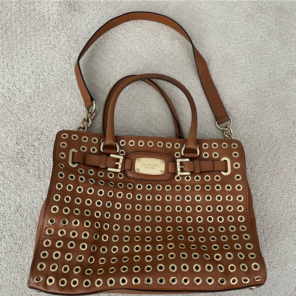 Gorgeous Michael Kors bag with gold grommets.